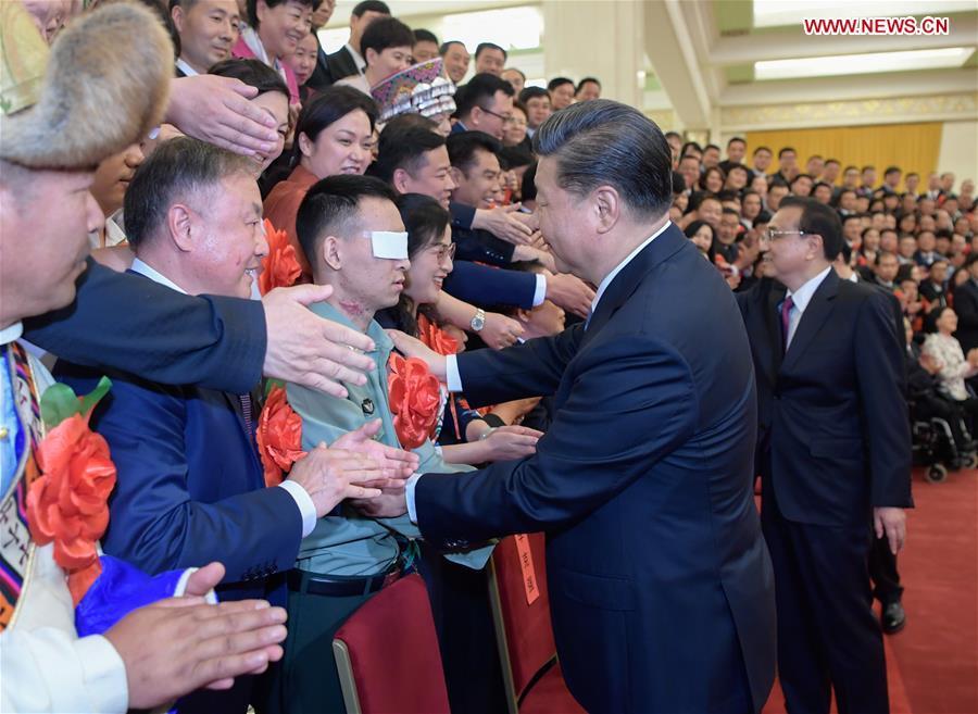 Chinese President Xi Jinping, also general secretary of the Communist Party of China (CPC) Central Committee and chairman of the Central Military Commission, meets with representatives attending a ceremony commending role models with disabilities and people who have made outstanding contributions in helping the disabled, at the Great Hall of the People in Beijing, capital of China, May 16, 2019. Premier Li Keqiang and Wang Huning, a member of the Secretariat of the CPC Central Committee, both members of the Standing Committee of the Political Bureau of the CPC Central Committee, also met with the representatives. (Xinhua/Li Xueren)