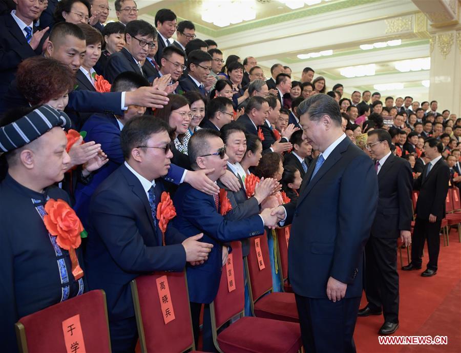 Chinese President Xi Jinping, also general secretary of the Communist Party of China (CPC) Central Committee and chairman of the Central Military Commission, meets with representatives attending a ceremony commending role models with disabilities and people who have made outstanding contributions in helping the disabled, at the Great Hall of the People in Beijing, capital of China, May 16, 2019. Premier Li Keqiang and Wang Huning, a member of the Secretariat of the CPC Central Committee, both members of the Standing Committee of the Political Bureau of the CPC Central Committee, also met with the representatives. (Xinhua/Li Xueren)