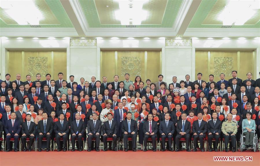 Chinese President Xi Jinping, also general secretary of the Communist Party of China (CPC) Central Committee and chairman of the Central Military Commission, meets with representatives attending a ceremony commending role models with disabilities and people who have made outstanding contributions in helping the disabled, at the Great Hall of the People in Beijing, capital of China, May 16, 2019. Premier Li Keqiang and Wang Huning, a member of the Secretariat of the CPC Central Committee, both members of the Standing Committee of the Political Bureau of the CPC Central Committee, also met with the representatives. (Xinhua/Ding Lin)