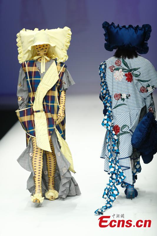 Models wear creations by a newcomer designer during the China Graduate Fashion Week in Beijing, May 19, 2019. The seven-day event concluded on Sunday night, with the announcement of ten winning newcomer designers. (Photo: China News Service/Sheng Jiapeng)