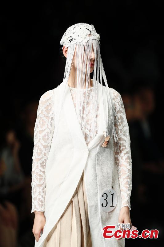 A model wears a creation by a newcomer designer during the China Graduate Fashion Week in Beijing, May 19, 2019. The seven-day event concluded on Sunday night, with the announcement of ten winning newcomer designers. (Photo: China News Service/Sheng Jiapeng)