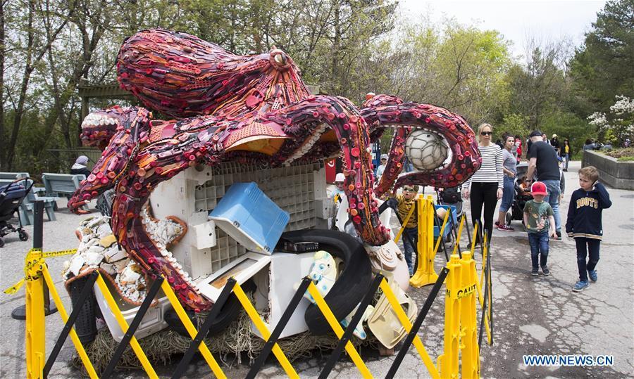People look at the art installation \