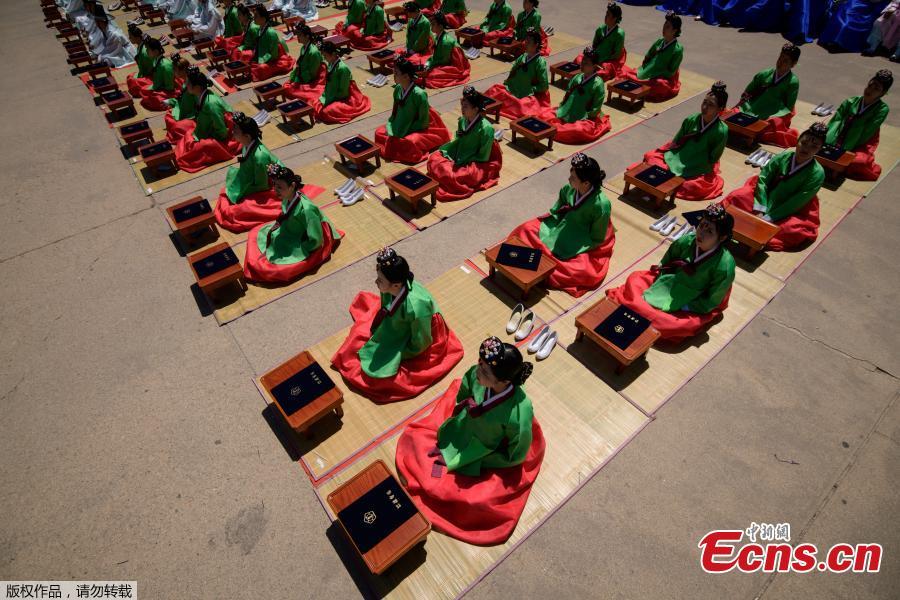 Participants attend a traditional Coming-of-Age Day ceremony to mark adulthood at Namsan hanok village in Seoul on May 20, 2019.  The ceremony marks the age of 19, at which a person is legally able to make life choices from voting, to drinking alcohol. (Photo/Agencies)