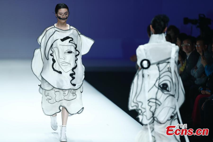 Models wear creations by a newcomer designer during the China Graduate Fashion Week in Beijing, May 19, 2019. The seven-day event concluded on Sunday night, with the announcement of ten winning newcomer designers. (Photo: China News Service/Sheng Jiapeng)