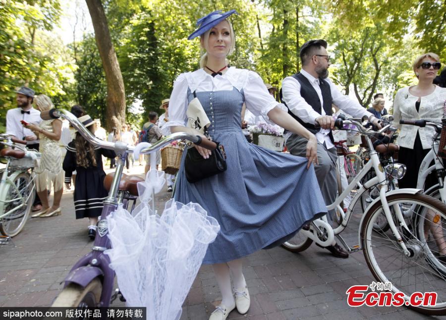 Participants with their bikes wearing vintage clothes attend Retro Cruise 2019, a retro parade on bicycles, similar of the known Tweed Run bike ride, in center of Kiev, Ukraine, on 19 May 2019.(Photo/Sipaphoto)
