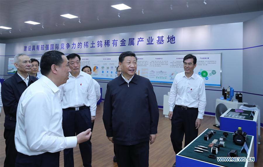 Chinese President Xi Jinping, also general secretary of the Communist Party of China Central Committee and chairman of the Central Military Commission, learns about the production process and operation of the JL MAG Rare-Earth Co. Ltd. as well as the development of the rare earth industry in the city of Ganzhou in east China\'s Jiangxi Province on May 20, 2019. Xi Jinping visited Jiangxi Province Monday on an inspection tour. (Xinhua/Ju Peng)