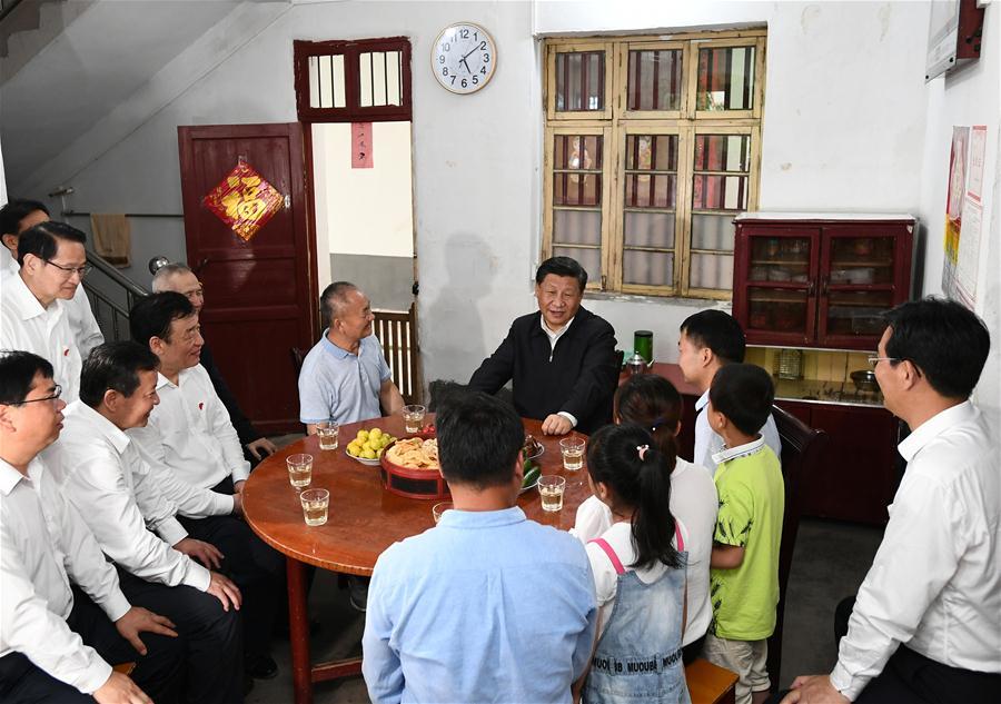 Chinese President Xi Jinping, also general secretary of the Communist Party of China Central Committee and chairman of the Central Military Commission, visits Tantou Village in Yudu County, Ganzhou City, during an inspection tour of east China\'s Jiangxi Province on May 20, 2019. At the home of veteran Sun Guanfa, a descendant of a Red Army martyr, Xi chatted with Sun\'s family and local officials, and learned in detail about the production developments and life improvements of people in the old revolutionary base. (Xinhua/Xie Huanchi)