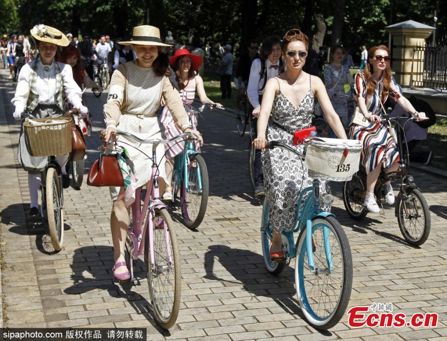 Participants with their bikes wearing vintage clothes attend Retro Cruise 2019, a retro parade on bicycles, similar of the known Tweed Run bike ride, in center of Kiev, Ukraine, on 19 May 2019.(Photo/Sipaphoto)