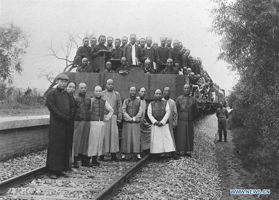 File photo taken in 1909 shows Zhan Tianyou (3rd R, Front) poses for a group photo with his colleagues for the completion of the Beijing-Zhangjiakou Railway. Zhan presided over the construction of the railway line, the first one designed and built by Chinese. (Xinhua)
