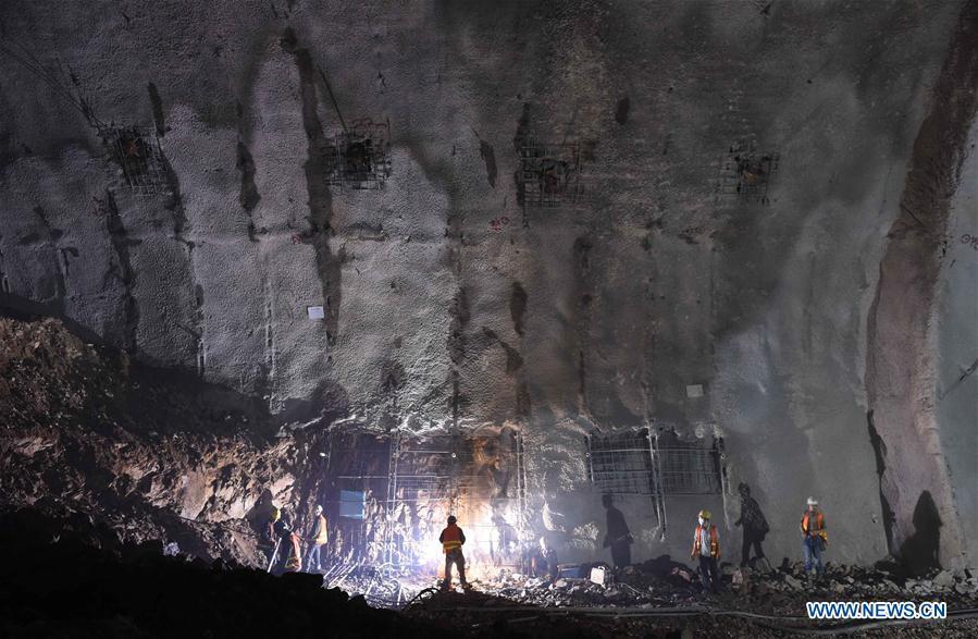 Workers are seen at the construction site of the Great Wall station of the Beijing-Zhangjiakou railway under the Badaling Great Wall area in Beijing, capital of China, Aug. 8, 2017. (Xinhua/Li Wen)