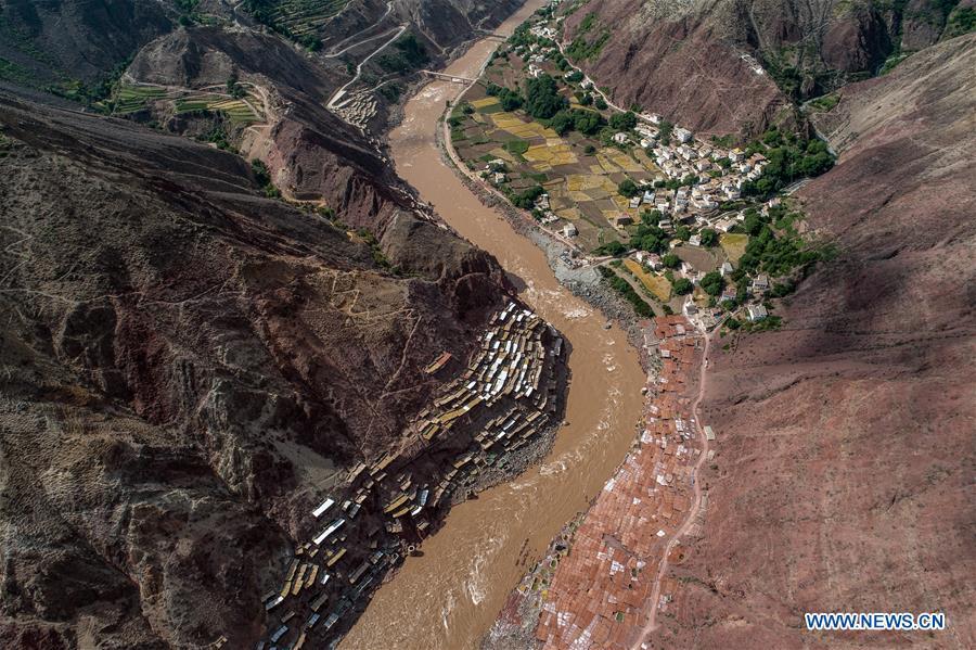 Aerial photo shows saline fields in Mangkam County, southwest China\'s Tibet Autonomous Region, May 22, 2019. An ancient technique of salt production since Tang Dynasty (618-907) is well-preserved in Mangkam County. Local people follow a salt harvesting method by collecting brines from salt mines and ponds and evaporating them in the sun until crystallization. (Xinhua/Li Xin)