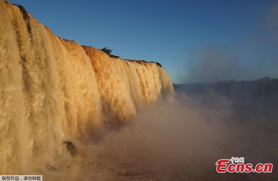 Picture of the Iguacu falls -considered as one of the largest waterfalls in the world- as seen from the Brazilian side on the border with Argentina, near Foz do Iguacu, on June 4, 2019. The quantity of water falling from the Iguacu falls at the border between Argentina and Brazil has doubled these last few days following heavy rains in the region. While the average flow rate of the falls is usually 1,5 million liters of water per second, the currently rate is at 3 million. (Photo/Agencies)