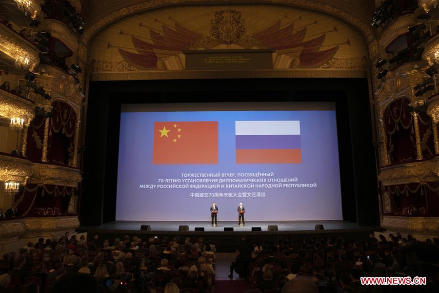 Chinese President Xi Jinping (L) and his Russian counterpart Vladimir Putin attend a gathering marking the 70th anniversary of the establishment of the China-Russia diplomatic relations at the Bolshoi Theater of Russia in Moscow June 5, 2019. (Xinhua/Yao Dawei)