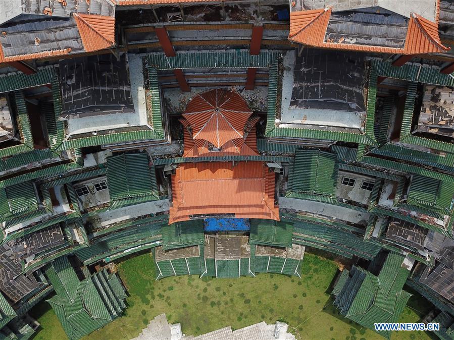 Aerial photo taken on June 7, 2019 shows a wooden building of Shui ethnic group in Yingshan Town of Dushan County, southwest China\'s Guizhou Province. The 24-story, 99.9-meter-high traditional Shui-style wooden building in Dushan is of \