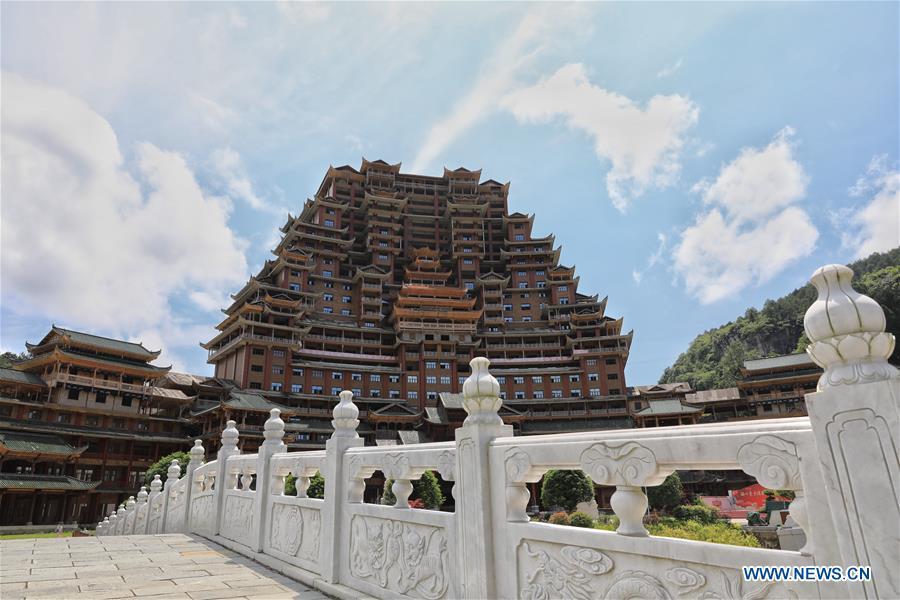 A wooden building of Shui ethnic group is seen in Yingshan Town of Dushan County, southwest China\'s Guizhou Province, June 7, 2019. The 24-story, 99.9-meter-high traditional Shui-style wooden building in Dushan is of \