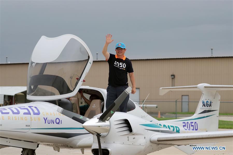 Zhang Bo waves to family members and friends after landing at an airport in Chicago, the United States, on June 9, 2019. After flying 68 days and making 50 stops, 57-year-old Bo Zhang completed his second around-the-world flight and landed in Chicago on Sunday morning. On April 2, Zhang kicked off the flight in the same airport in Chicago. In 68 days, he flied through 21 countries in three continents and over three oceans, with total mileage reaching 41,000 kilometers. (Xinhua/Wang Ping)