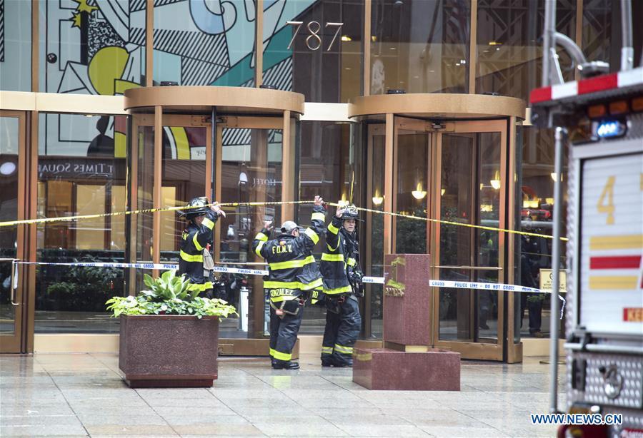 Fire fighters enter the building where a helicopter crashed in Manhattan, New York, the United States, June 10, 2019. One person was killed after a helicopter crashed onto the roof of a skyscraper in Midtown Manhattan of New York City Monday afternoon, according to media reports. (Xinhua/Wang Ying)