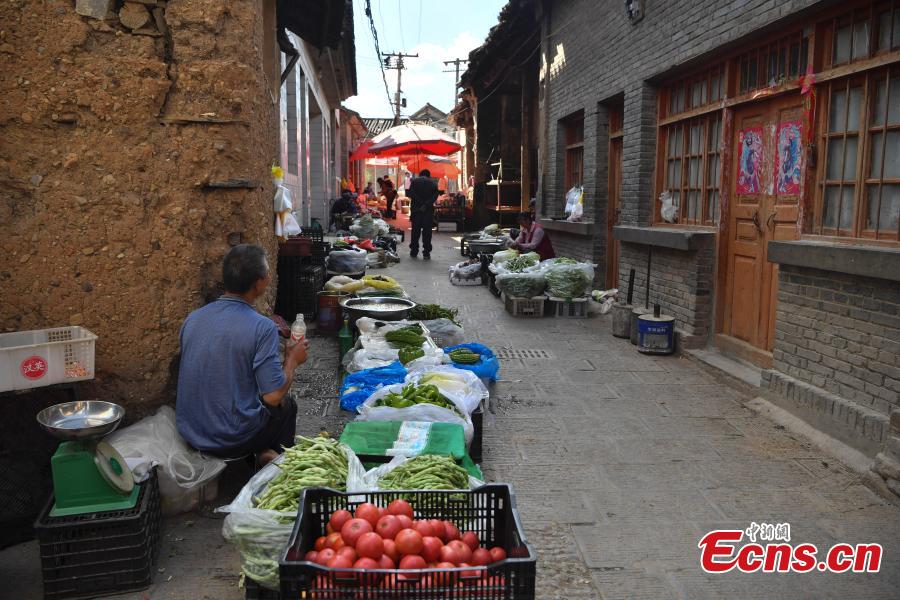 Photo taken on June 5, 2019 shows Baiwu Village located in Nagu Township, Huize County, Yunnan Province. For many centuries this place was an important trading center that revolved around the copper industry. In addition to the beautiful landscape, the village has many well-preserved buildings that date back to Ming and Qing dynasties. In 2005, Baiwu Village was recognized as a Chinese Famous Village of Culture and History. (Photo: China News Service/Liu Ranyang)