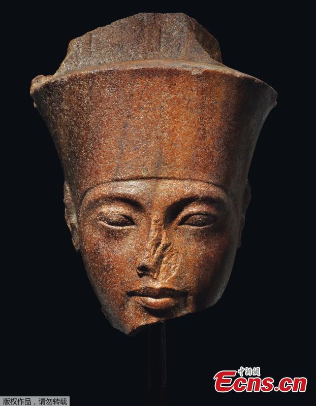 Photo shows an Egyptian head of the God Amen with the features of the Pharaoh Tutankhamen circa 1333-1323 B.C., which is up for auction at Christie\'s. (Photo/Agencies)