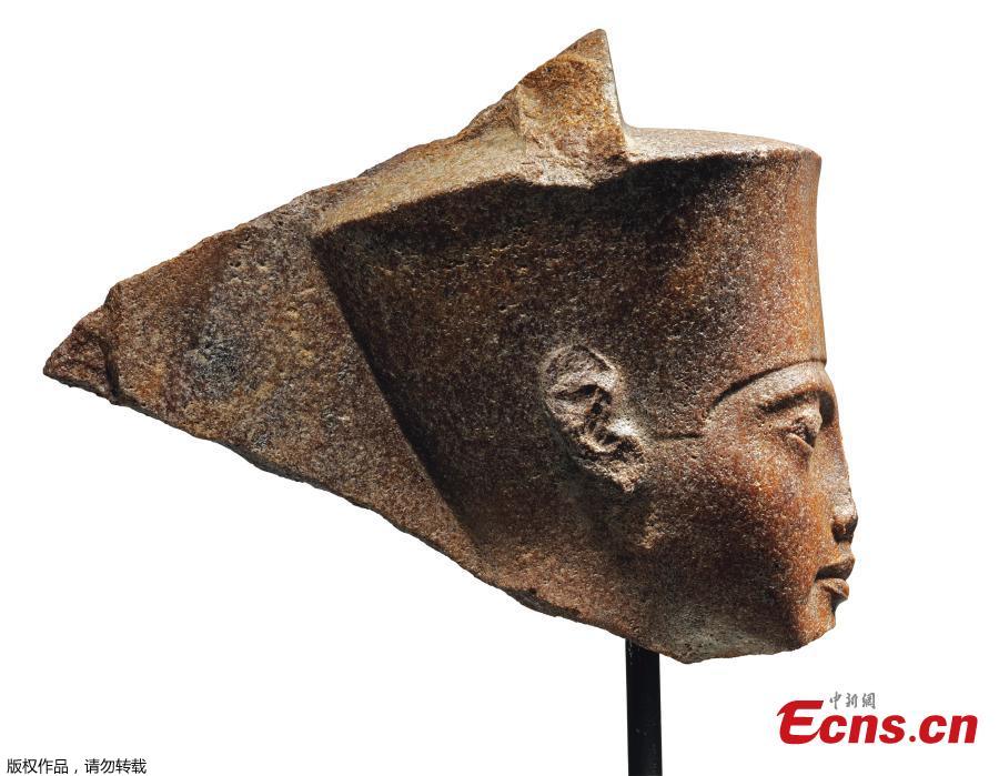 Photo shows an Egyptian head of the God Amen with the features of the Pharaoh Tutankhamen circa 1333-1323 B.C., which is up for auction at Christie\'s. (Photo/Agencies)

The Egyptian Ministry of Antiquities believes the statue, expected to raise 4 mln pounds at auction in the UK, was taken out of the country illegally.