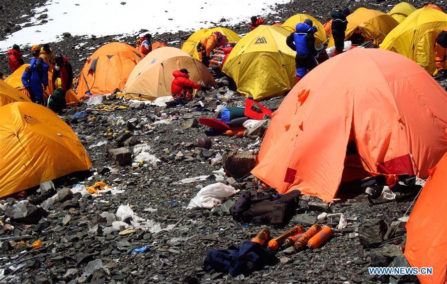 Photo taken on March 12, 2008 shows camps and discarded wastes in the Sagarmatha (Mt. Qomolangma) National Park in Nepal. (Xinhua/SPCC)