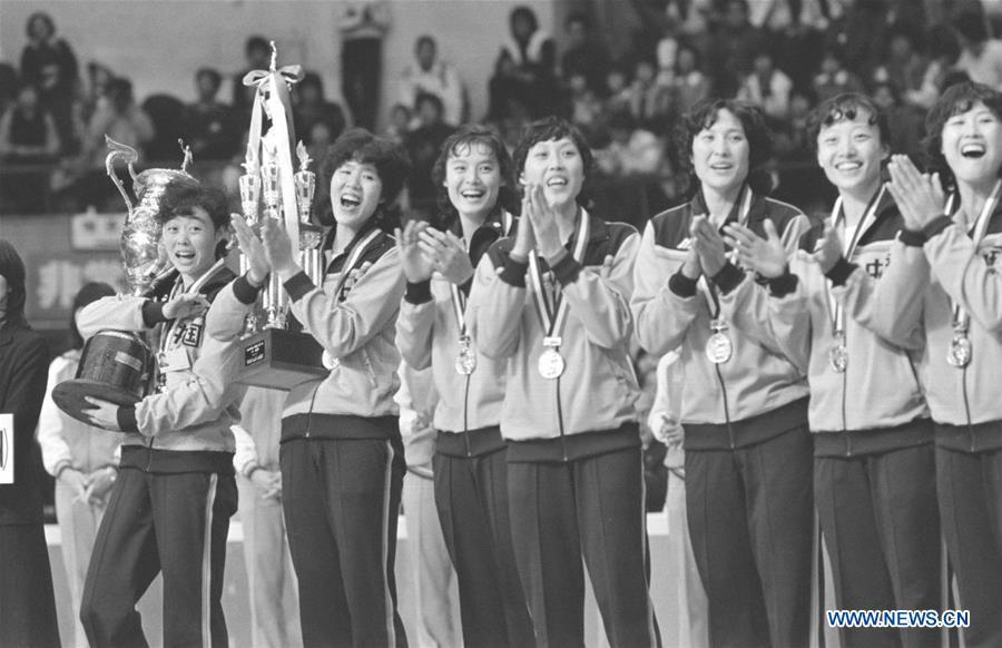 Members of the women\'s volleyball team of China attend the awarding ceremony after winning the gold medal with seven straight victories at the FIVB Women\'s Volleyball World Cup in Osaka, Japan, Nov. 16, 1981. This year marks the 70th anniversary of the founding of the People\'s Republic of China (PRC). On April 5, 1959, Rong Guotuan won the champion of the men\'s singles event at the 25th ITTF World Table Tennis Championships in Dortmund, Germany, becoming China\'s first ever world champion. Chinese players have made more achievements during the 60 years since then. (Xinhua/Li Qirong)