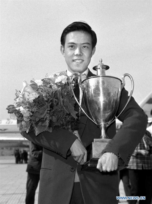 Rong Guotuan holds the trophy upon returning to China April 22, 1959 from the 25th ITTF World Championships held in Dortmund of Germany. This year marks the 70th anniversary of the founding of the People\'s Republic of China (PRC). On April 5, 1959, Rong Guotuan won the champion of the men\'s singles event at the 25th ITTF World Table Tennis Championships in Dortmund, Germany, becoming China\'s first ever world champion. Chinese players have made more achievements during the 60 years since then. (Xinhua/Zhang Hesong)