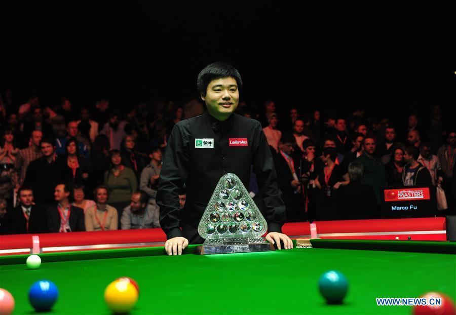 Ding Junhui of China poses with the trophy after winning the 2011 Snooker Masters in London, Britain, Jan. 16, 2011. This year marks the 70th anniversary of the founding of the People\'s Republic of China (PRC). On April 5, 1959, Rong Guotuan won the champion of the men\'s singles event at the 25th ITTF World Table Tennis Championships in Dortmund, Germany, becoming China\'s first ever world champion. Chinese players have made more achievements during the 60 years since then. (Xinhua/Zeng Yi)