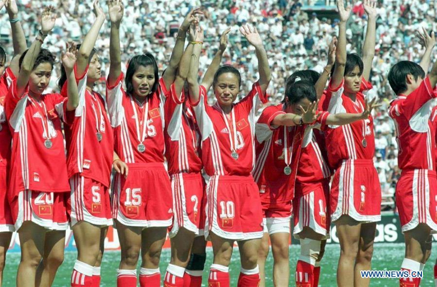 Chinese players attend the awarding ceremony after winning the silver medal at the 3rd FIFA Women\'s World Cup finals in Los Angeles, the United States, July 10, 1999. This year marks the 70th anniversary of the founding of the People\'s Republic of China (PRC). On April 5, 1959, Rong Guotuan won the champion of the men\'s singles event at the 25th ITTF World Table Tennis Championships in Dortmund, Germany, becoming China\'s first ever world champion. Chinese players have made more achievements during the 60 years since then. (Xinhua/Wang Yan)
