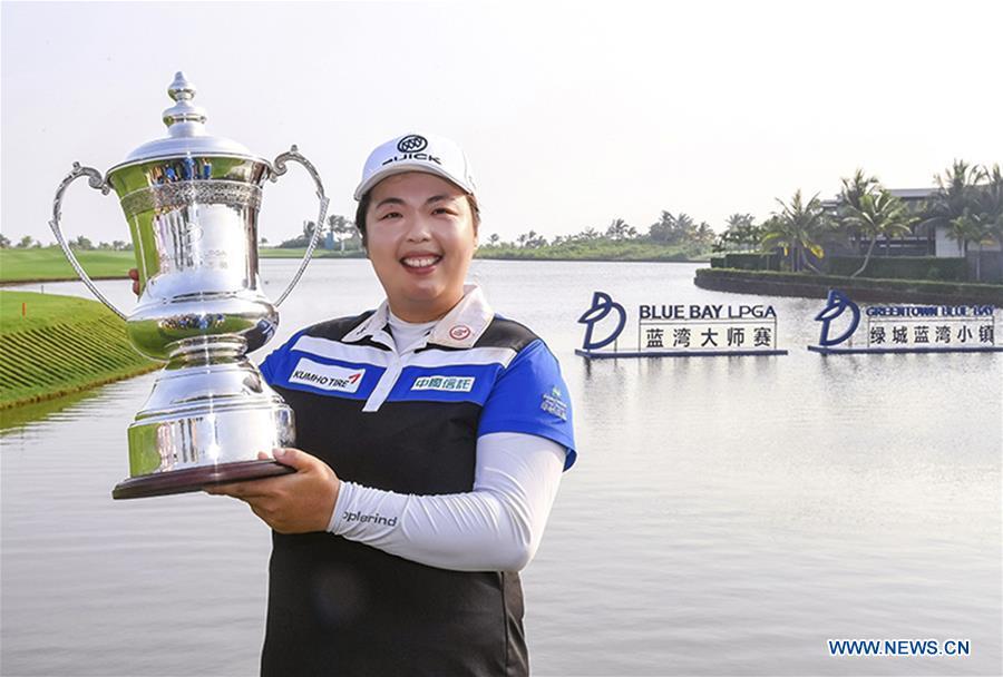 Feng Shanshan of China shows the trophy after claiming the title at the Blue Bay LPGA in Lingshui, south China\'s Hainan Province, Nov. 11, 2017. This year marks the 70th anniversary of the founding of the People\'s Republic of China (PRC). On April 5, 1959, Rong Guotuan won the champion of the men\'s singles event at the 25th ITTF World Table Tennis Championships in Dortmund, Germany, becoming China\'s first ever world champion. Chinese players have made more achievements during the 60 years since then. (Xinhua)