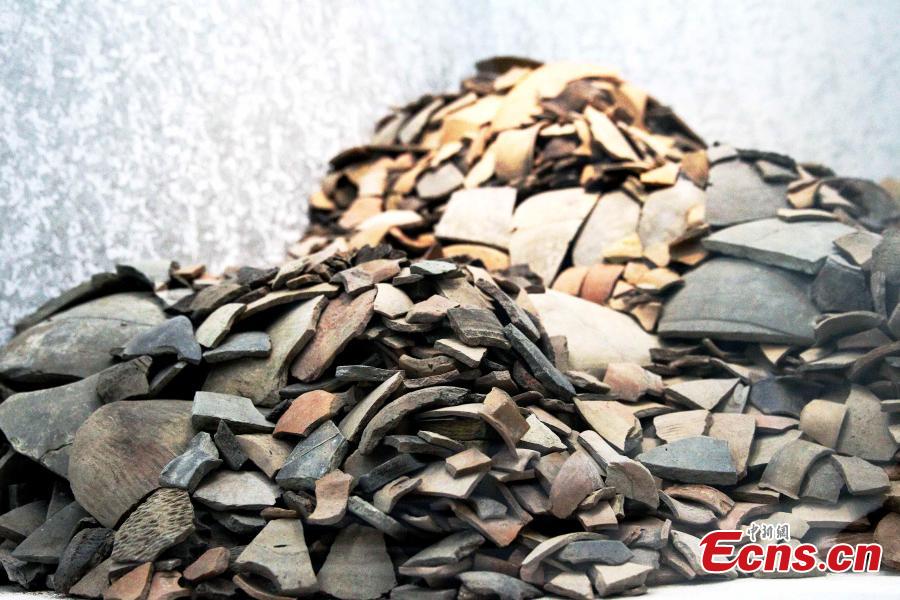 Some 192 artifacts made of stone, bone, pottery and bronze, unearthed from the Shenna site, are on display at an exhibition at the Xining Museum in Xining City, Northwest China’s Qinghai Province, June 12, 2019. Shenna is located on the bank of the Beichuan River in Xining, covering an area of approximately 100,000 square meters. It was home to the Qijia culture approximately 4,000 years ago. (Photo: China News Service/ Zhang Tianfu)