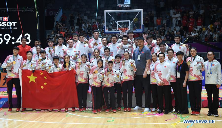 Members of the men\'s and women\'s basketball teams of China pose for photo after winning both men\'s and women\'s titles at the 18th Asian Games in Jakarta, Indonesia, Sept. 1, 2018. This year marks the 70th anniversary of the founding of the People\'s Republic of China (PRC). On April 5, 1959, Rong Guotuan won the champion of the men\'s singles event at the 25th ITTF World Table Tennis Championships in Dortmund, Germany, becoming China\'s first ever world champion. Chinese players have made more achievements during the 60 years since then. (Xinhua/Huang Zongzhi)