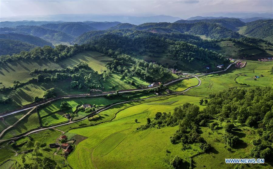 Aerial photo taken on June 12, 2019 shows the view of Guanshan Grassland at Longxian County in Baoji, northwest China\'s Shaanxi Province. (Xinhua/Tao Ming)