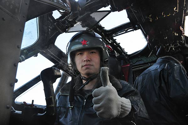 A pilot gives a thumbsup for takeoff at the Harbin Flight Academy of the PLA Air Force. Provided To China Daily A pilot gives a thumbsup for takeoff at the Harbin Flight Academy of the PLA Air Force. Provided To China Daily
