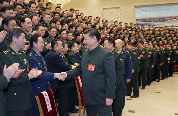 Xi Jinping, general secretary of the Communist Party of China (CPC) Central Committee, who is also Chinese president and chairman of the Central Military Commission, meets with delegates, specially invited delegates and non-voting participants of the 19th CPC National Congress from the People's Liberation Army (PLA) and the armed police forces before meeting senior military officers in Beijing, capital of China, Oct. 26, 2017. (Xinhua/Li Gang) Xi Jinping, general secretary of the Communist Party of China (CPC) Central Committee, who is also Chinese president and chairman of the Central Military Commission, meets with delegates, specially invited delegates and non-voting participants of the 19th CPC National Congress from the People's Liberation Army (PLA) and the armed police forces before meeting senior military officers in Beijing, capital of China, Oct. 26, 2017. (Xinhua/Li Gang)
