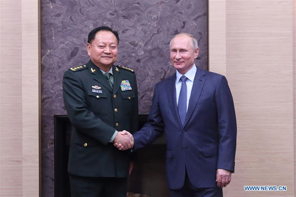 Russian President Vladimir Putin (R) meets with Zhang Youxia, a member of the Political Bureau of the Communist Party of China (CPC) Central Committee and vice chairman of the CPC Central Military Commission, in Moscow, Russia, on Dec. 7, 2017. (Xinhua/Li Xiaowei) Russian President Vladimir Putin (R) meets with Zhang Youxia, a member of the Political Bureau of the Communist Party of China (CPC) Central Committee and vice chairman of the CPC Central Military Commission, in Moscow, Russia, on Dec. 7, 2017. (Xinhua/Li Xiaowei)