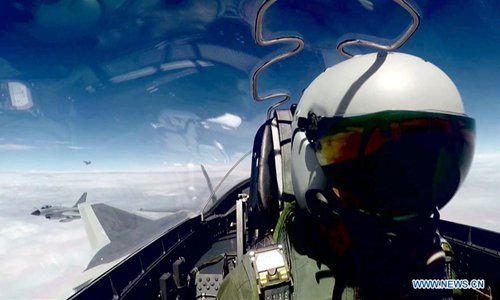 Undated file photo shows China's J-20 stealth fighter jets taking part in their first-ever combat training over the ocean. China's J-20 stealth fighter jets have begun their first-ever combat training over the ocean, a spokesperson confirmed Wednesday. The J-20 is China's fourth-generation medium and long-range fighter aircraft and was commissioned into air force combat service earlier this year. (Xinhua) Undated file photo shows China's J-20 stealth fighter jets taking part in their first-ever combat training over the ocean. China's J-20 stealth fighter jets have begun their first-ever combat training over the ocean, a spokesperson confirmed Wednesday. The J-20 is China's fourth-generation medium and long-range fighter aircraft and was commissioned into air force combat service earlier this year. (Xinhua)