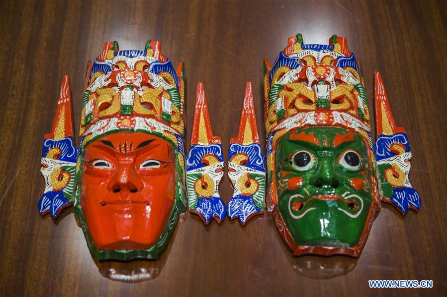 Wooden facial mask of local folk opera in Guizhou