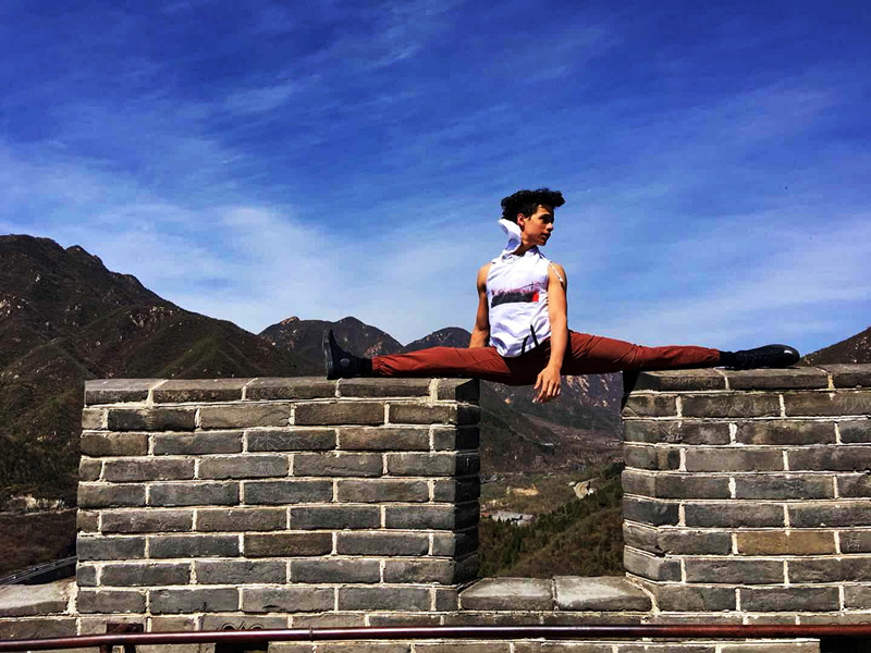 U.S. teenagers strike dance poses along the Great Wall