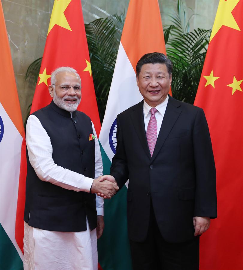 Xi meets Modi to discuss China-India ties