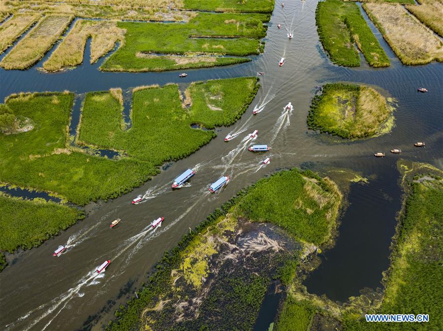 Tourists visit Baiyangdian lake in Xiongan New Area