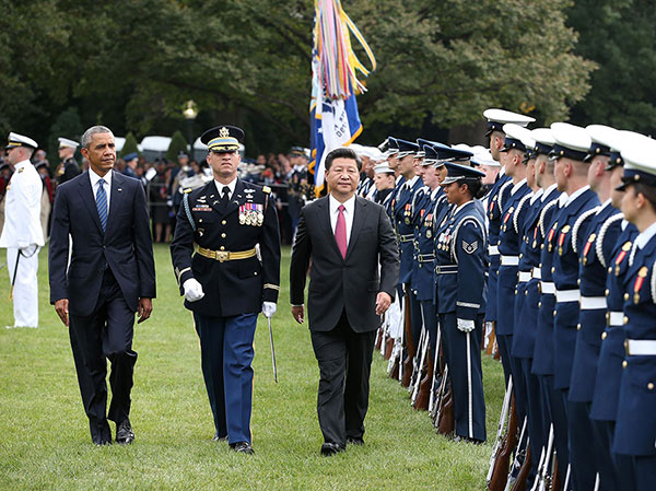 Chinese President Xi Jinping (R) is welcomed by U.S. President Barack Obama (L) at the South Lawn of the White House in Washington DC, the United States, Sept 25, 2015. Xi arrived in Washington, the second stop of his first state visit to the United States, on Thursday after a busy two-and-a-half-day stay in West Coast hub Seattle. (Photo/Xinhua) Chinese President Xi Jinping (R) is welcomed by U.S. President Barack Obama (L) at the South Lawn of the White House in Washington DC, the United States, Sept 25, 2015. Xi arrived in Washington, the second stop of his first state visit to the United States, on Thursday after a busy two-and-a-half-day stay in West Coast hub Seattle. (Photo/Xinhua)