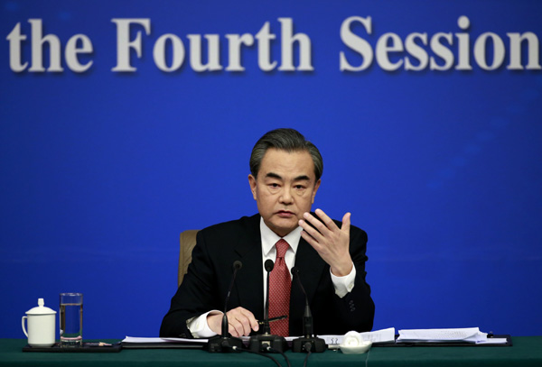 Chinese Foreign Minister Wang Yi takes questions from the press during a news conference on the sidelines of the two sessions on Tuesday. (Photo by Feng Yongbin/chinadaily.com.cn) Chinese Foreign Minister Wang Yi takes questions from the press during a news conference on the sidelines of the two sessions on Tuesday. (Photo by Feng Yongbin/chinadaily.com.cn)