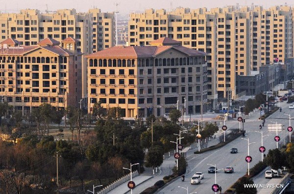 Photo taken on Jan 1, 2015 shows an apartment project in Huzhou, East China's Zhejiang province. (Photo/Xinhua) Photo taken on Jan 1, 2015 shows an apartment project in Huzhou, East China's Zhejiang province. (Photo/Xinhua)